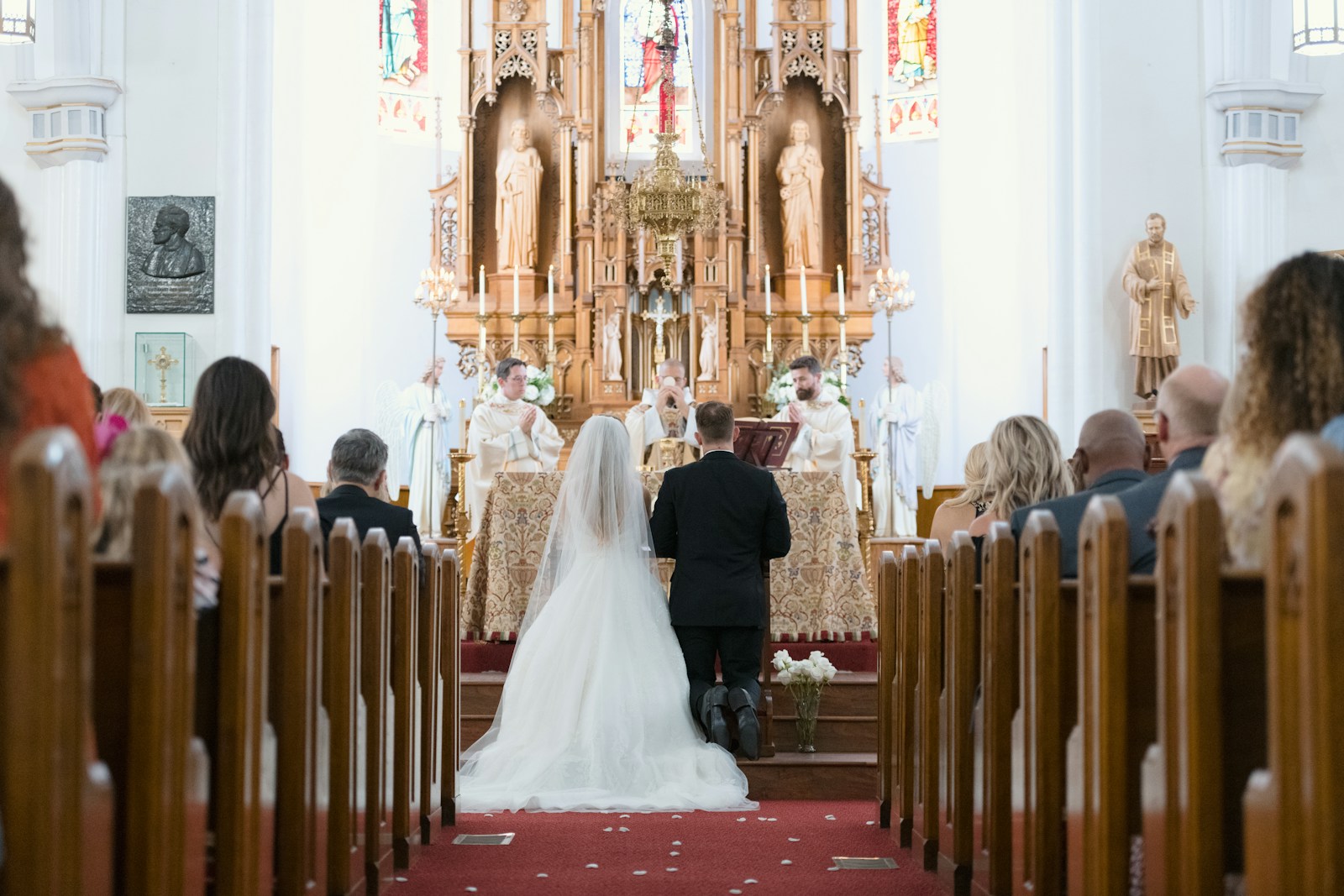Photo by Josh Applegate a bride and groom walking down the aisle in a church